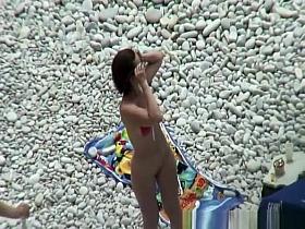 Nude woman preparing food