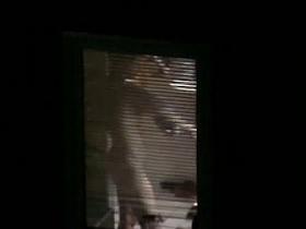 Nude candid female with a big sexy ass filmed through a window