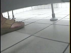 Women's toilet pissing spy cam video starring several ladies