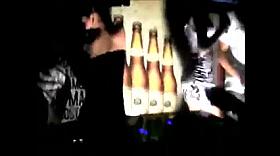 Two slutty girls flashing pussy in a club