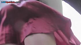 Amateur chick shows off g-string in candid upskirts