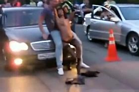 Girl strips and dances on a guy