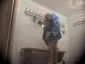 Dressing room video of girl in bath robe after shower
