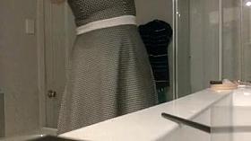 Pretty dress on a girl undressing to shower