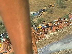 Lush bodied MILF parades before a nude beach voyeur