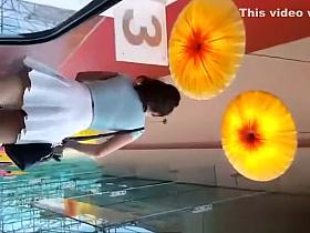 Brunette wearing white mini skirt