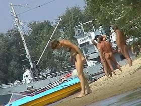 Hot beach voyeur video shows mature nudists enjoying each others company.