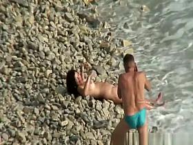 Nude brunette woman posing for the camera