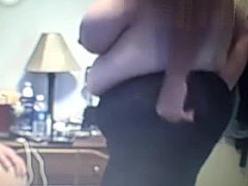 her big tittys then she puts on her black body stocking.