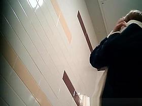 Teen pissing in public toilet