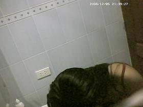 Asian cutie is getting undressed in the bathroom