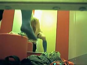 Petite blonde shaking her small tits in fitting room