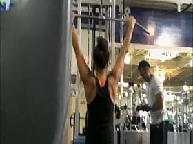 Chick in tight blue spandex pants exercising