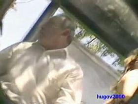 A blonde goddess gets her thongs filmed when the wind blows her orange skirt