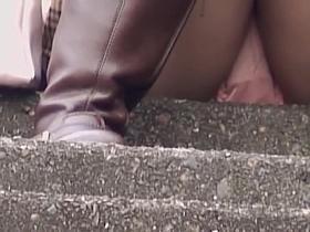 A Woman Wearing Panties And Thigh Boots Voyeur