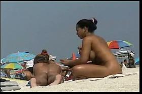 Sexy babes filmed playing on the beach