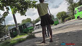 Upskirting young girlfriend that is waiting for a bus