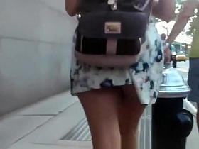Teen in short dress upskirted in street