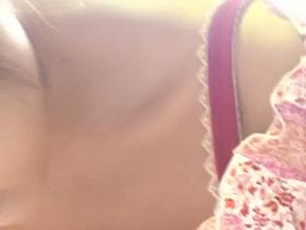 hot and sexy downblouse shot of an Asian chick bending forward