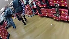 Upskirt on rolling escalators at shopping