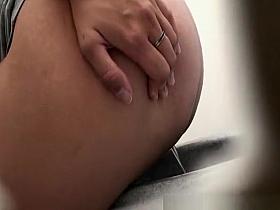 Woman spreading butt cheeks to pee