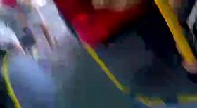 Cool chick with a bus with black curly hair.