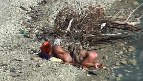Couple fucking on a public beach, while walking past people