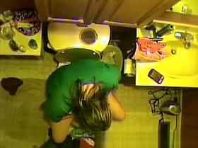 Taking a pee and looking at her own pussy