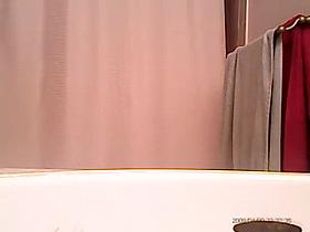 Hidden camera, shower time.