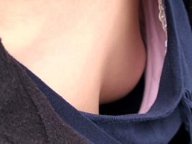 Asian sweetie lets a voyeur peek down her blouse