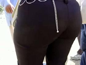 Busty babe showing butt crack on candid spy cam