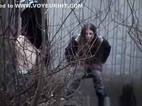 Teens peeing byonde shed