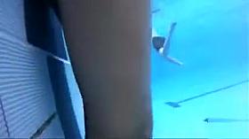 Playgirl tugs on a friend's dick in the pool