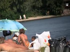 Nudist woman smile on her butt