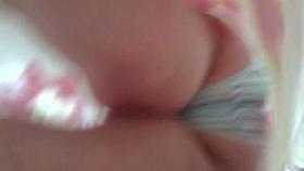 Short haired MILF gives up an up skirt view of her butt