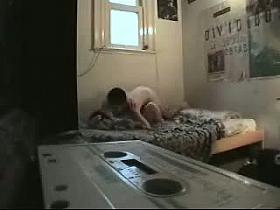 Real hidden cam sex features a couple banging on the bed.