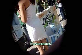 Hot upskirt voyeur peeks up the dress of a hot hostess