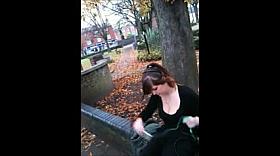 A dude is filming the cleavage of a sexy gal