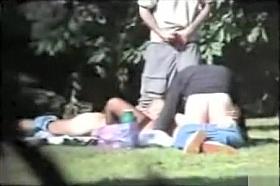 Group of old daddies fool around with woman in the grass