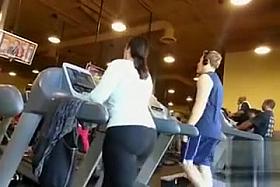 Fat ass woman walks on the treadmill