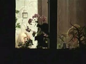 Stunning mature bitch is dressing up by the window