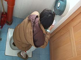 Chicks pissing in the public toilet and being filmed with a spy cam