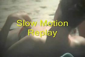 The downblouse girl becomes an object of a hidden spy cam on the beach