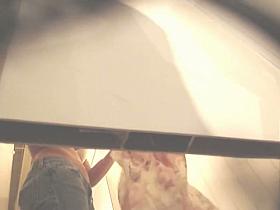 Girl in jeans and bra gets spied from below by hidden cam