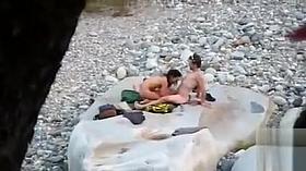 Slim brunette honey enjoys blowing a dick at the beach