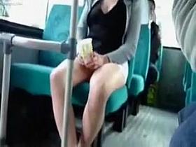 Leggy girl showing pussy on a bus