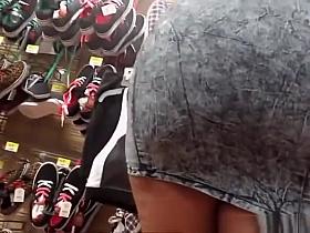 Ebony woman in short dress upskirt