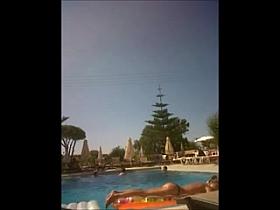 Topless girl in pool