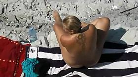 Nude milf gets out of the ocean