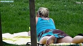 Voyeur spied her relaxing on the grass